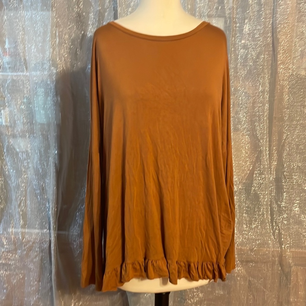 Long sleeve ruffled bottom blouse
